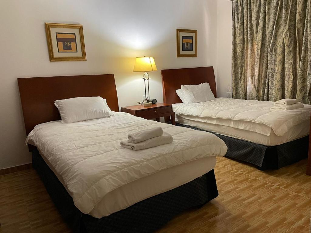 Postel nebo postele na pokoji v ubytování Tell Madaba