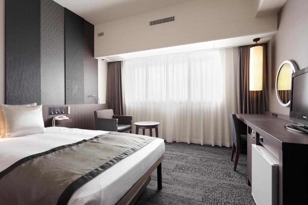 Postel nebo postele na pokoji v ubytování Art Hotel Narita