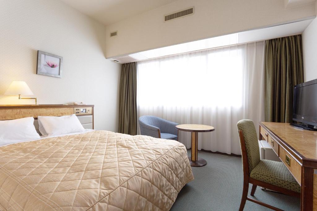 Postel nebo postele na pokoji v ubytování Art Hotel Narita
