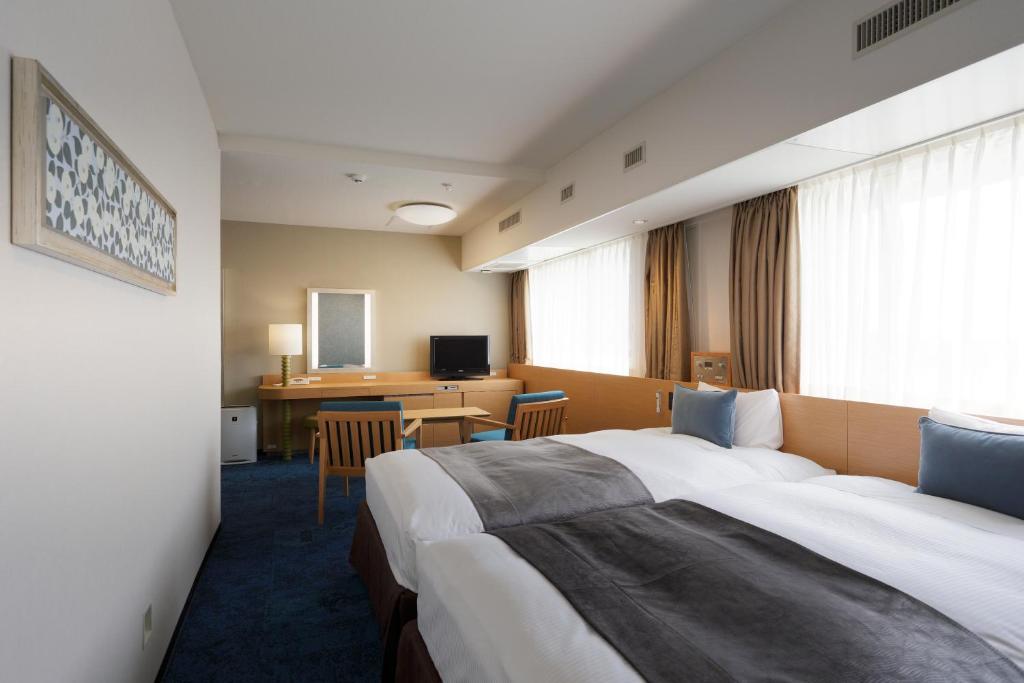 Postel nebo postele na pokoji v ubytování Art Hotel Narita