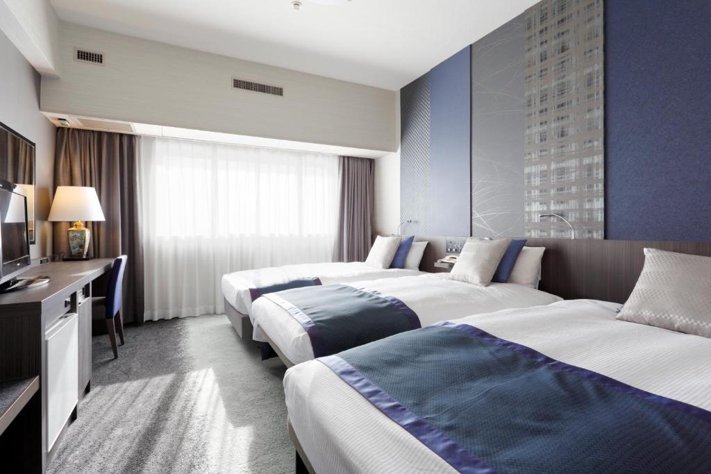 Postel nebo postele na pokoji v ubytování Art Hotel Narita