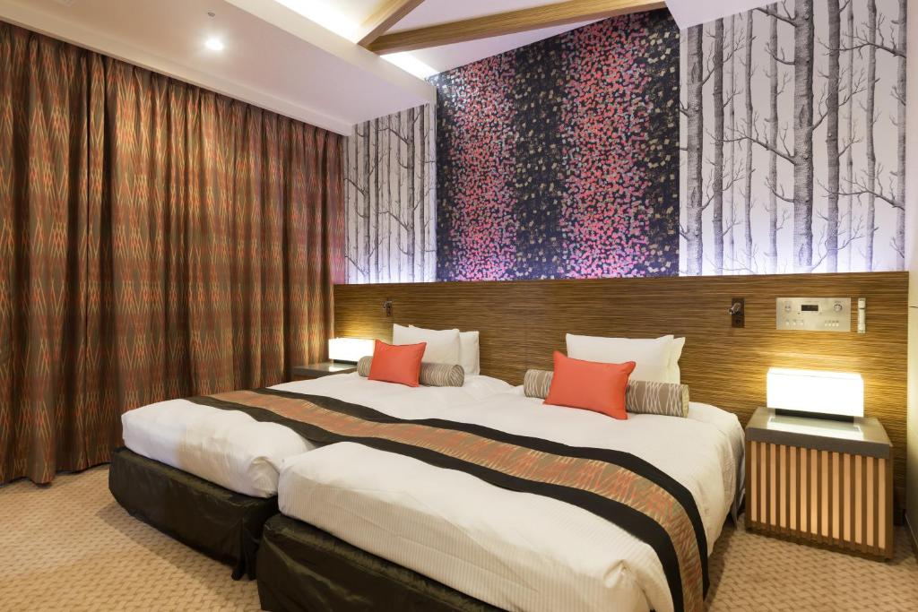 Postel nebo postele na pokoji v ubytování Art Hotel Narita