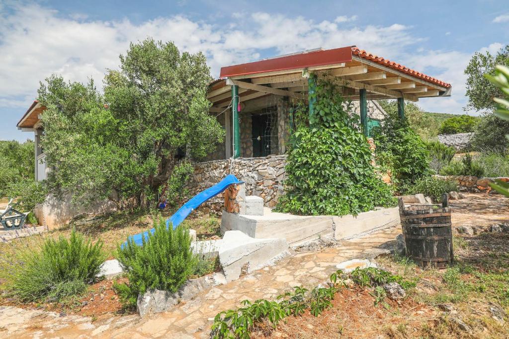 a house with a gazebo in a yard at House Murtelica in Tkon