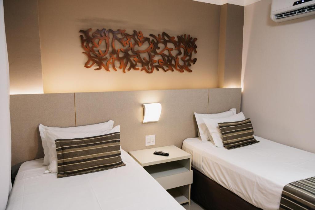 Cama ou camas em um quarto em Lagoon Prime Hotel