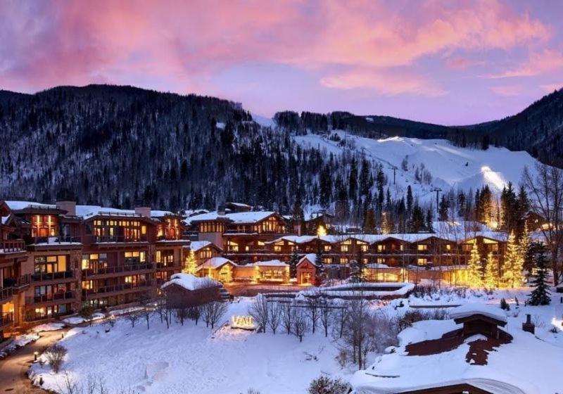 a resort in the mountains with snow on the ground at Slopeside 3 Bedroom Gold-rated Residence At Golden Peak Steps To Vail Village in Vail