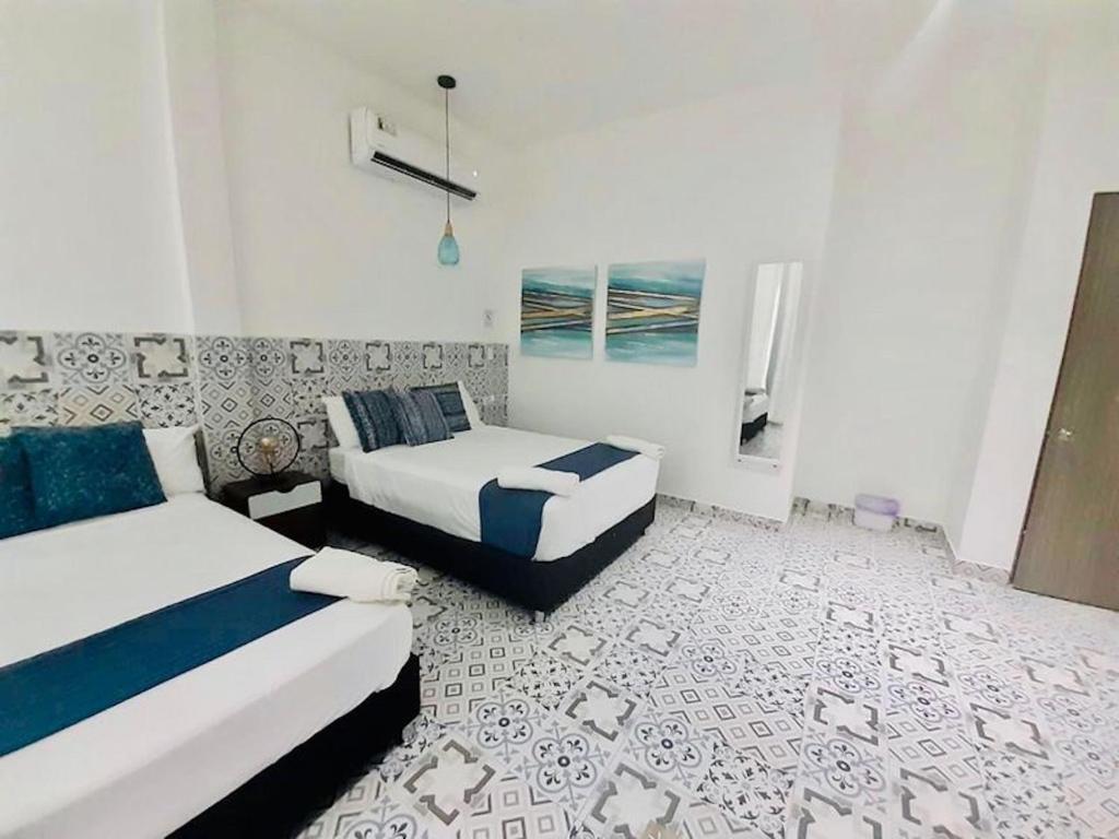 Postel nebo postele na pokoji v ubytování Room in Lodge - Hotel San Andres Isla Colombia