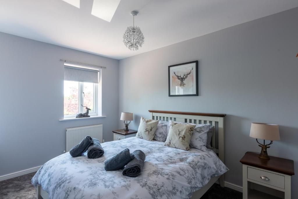 a bedroom with a bed with shoes on it at Number 4 in Bishop Auckland