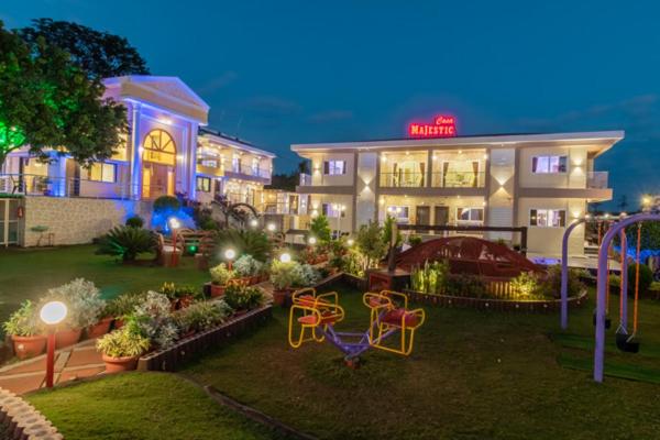 a hotel with a playground in front of a building at Casa Majestic Resort and SPA in Panchgani