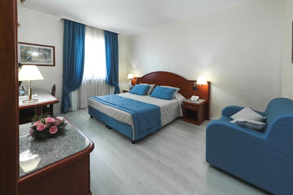Postel nebo postele na pokoji v ubytování Edra Palace Hotel & Ristorante