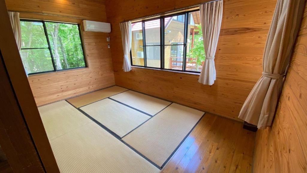 Tabinoteitaku Yakurai Cottageにあるベッド