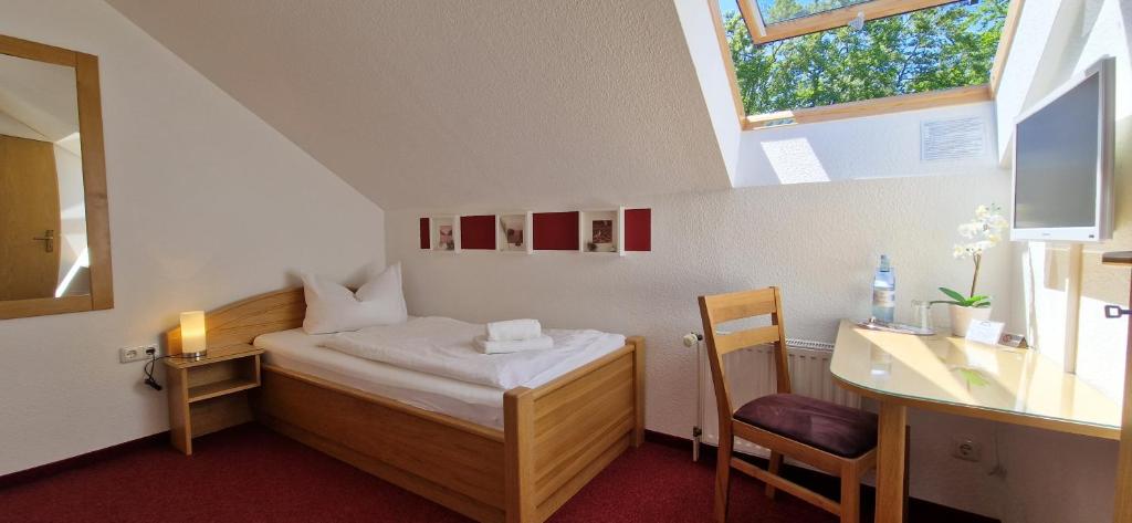 Postel nebo postele na pokoji v ubytování Pension Haus Waldesblick