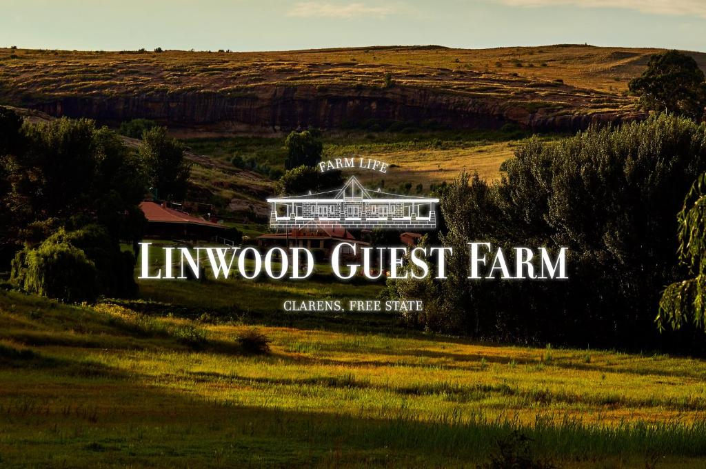a sign for a guest farm in a field at Linwood Guest Farm in Clarens
