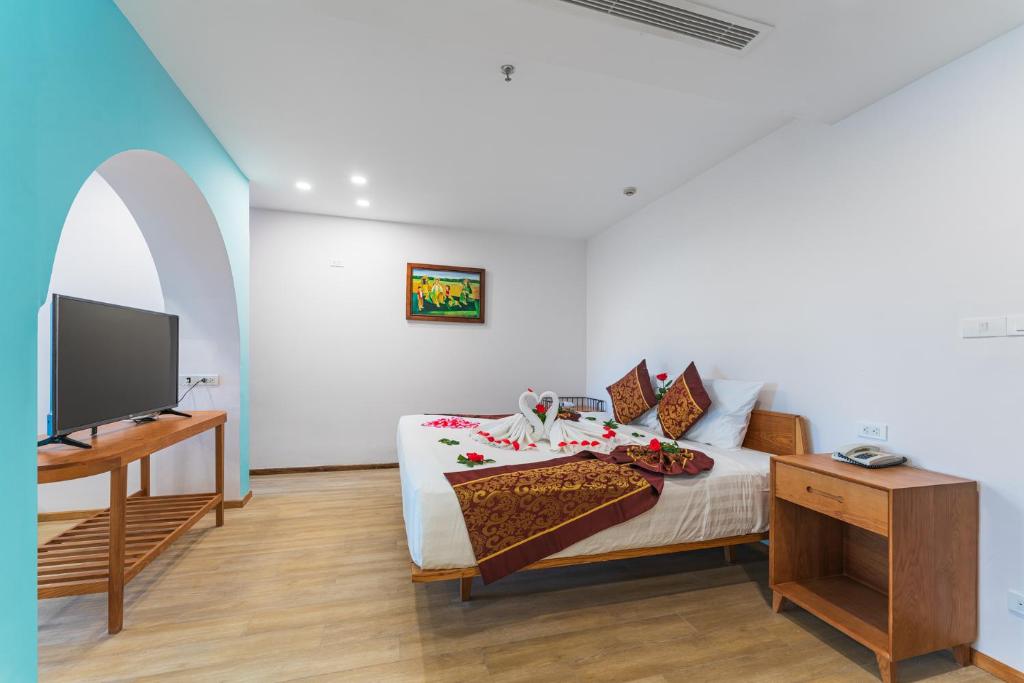 Postel nebo postele na pokoji v ubytování Prime New Hotel