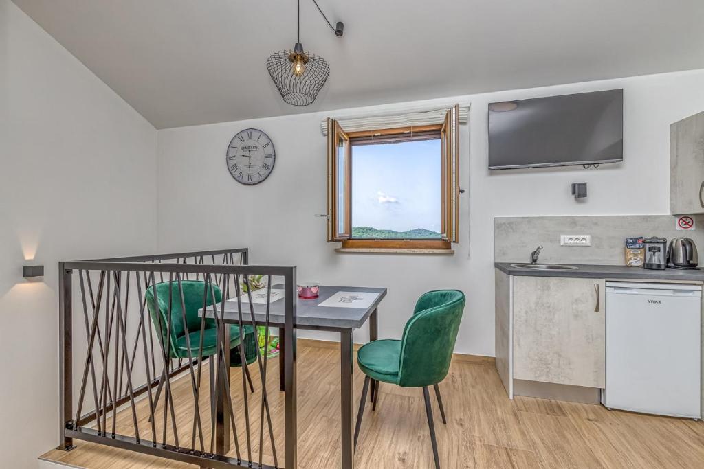 Kuchyň nebo kuchyňský kout v ubytování Rooms Nilda