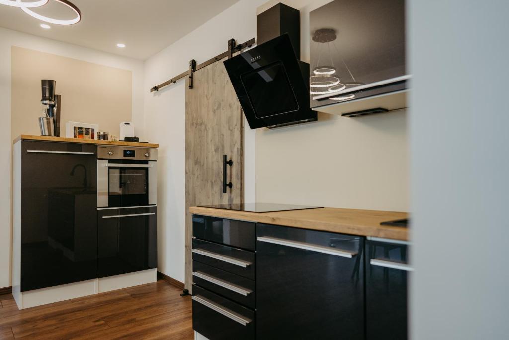 Kuchyň nebo kuchyňský kout v ubytování Ferienhaus25