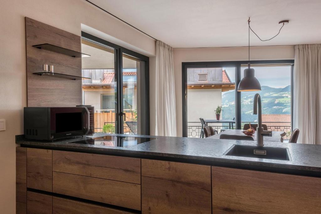 Kuchyň nebo kuchyňský kout v ubytování Aumia Apartment Rubin