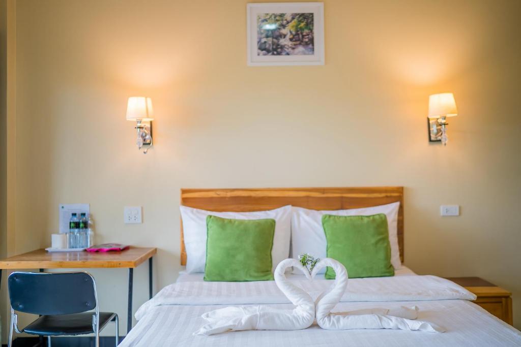 Postel nebo postele na pokoji v ubytování Tontan Resort Cha-am