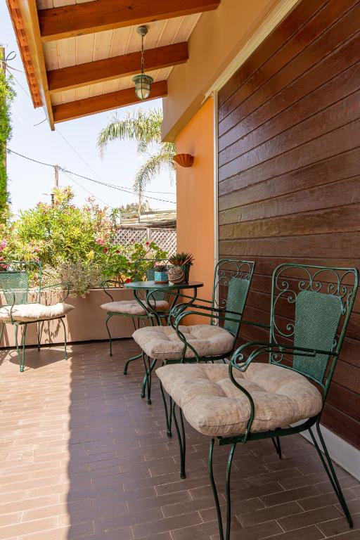 A balcony or terrace at Anna's Sea House near to a sandy beach!