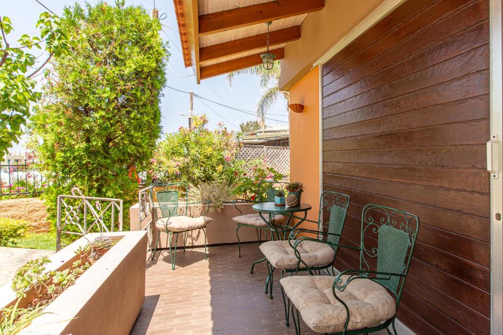 A balcony or terrace at Anna's Sea House near to a sandy beach!