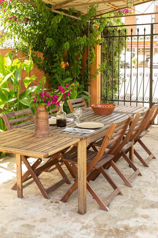A patio or other outdoor area at Anna's Sea House near to a sandy beach!