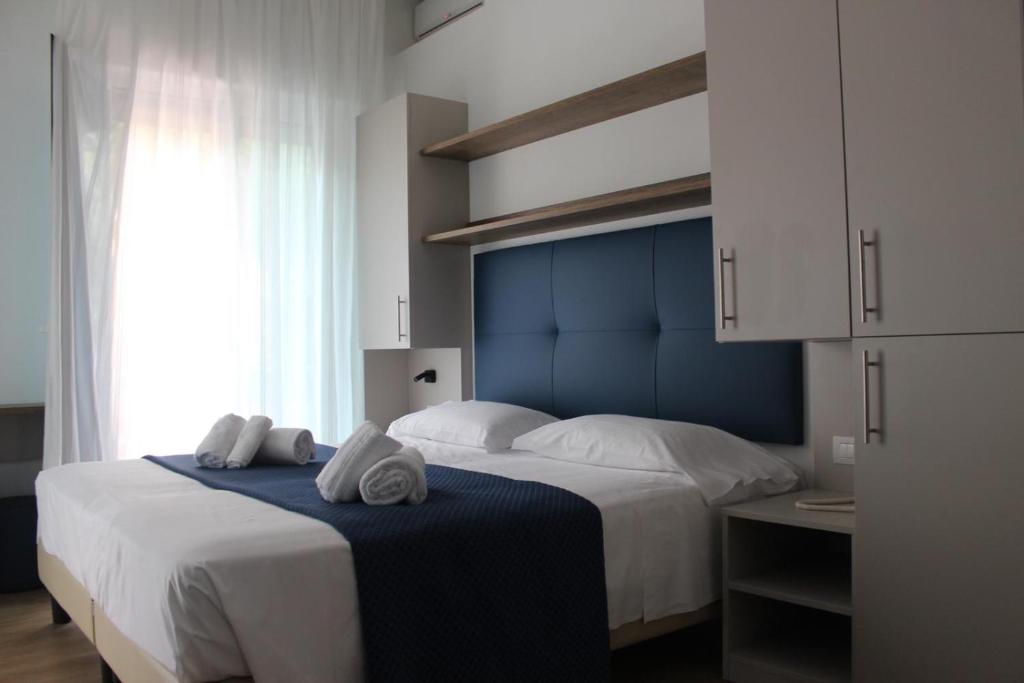 Postel nebo postele na pokoji v ubytování Hotel Danieli
