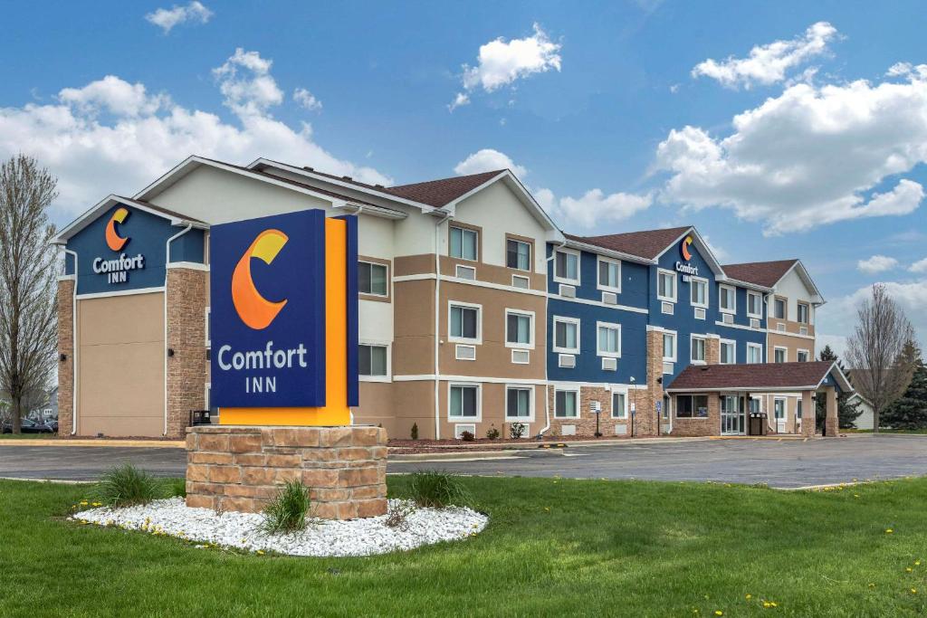 a building with a c comfort inn sign in front of it at Comfort Inn Mount Pleasant - Racine in Racine