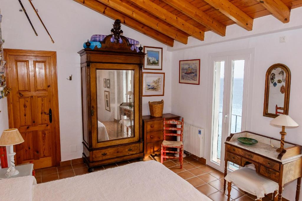 En eller flere senge i et værelse på Casita Blanca