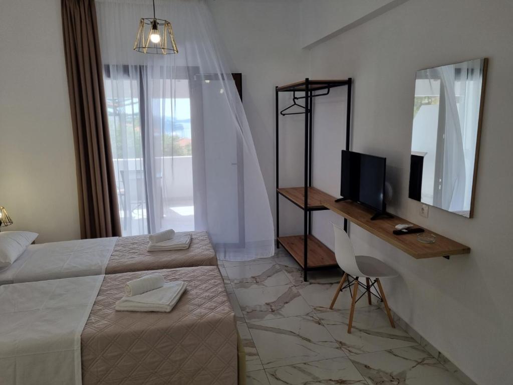Postel nebo postele na pokoji v ubytování MANGO Skiathos