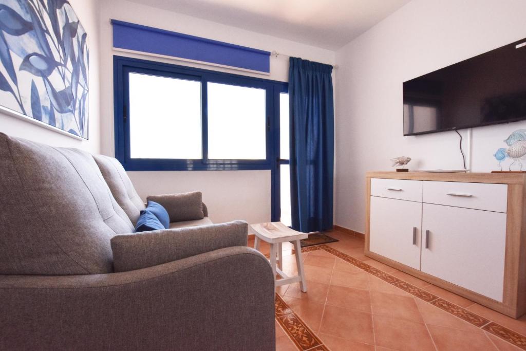 A television and/or entertainment centre at Book Jet - Costa Calma Sun & Pool