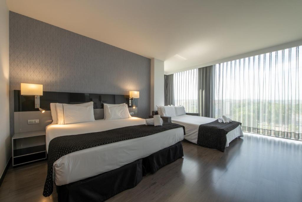 Posteľ alebo postele v izbe v ubytovaní Eurostars Palace