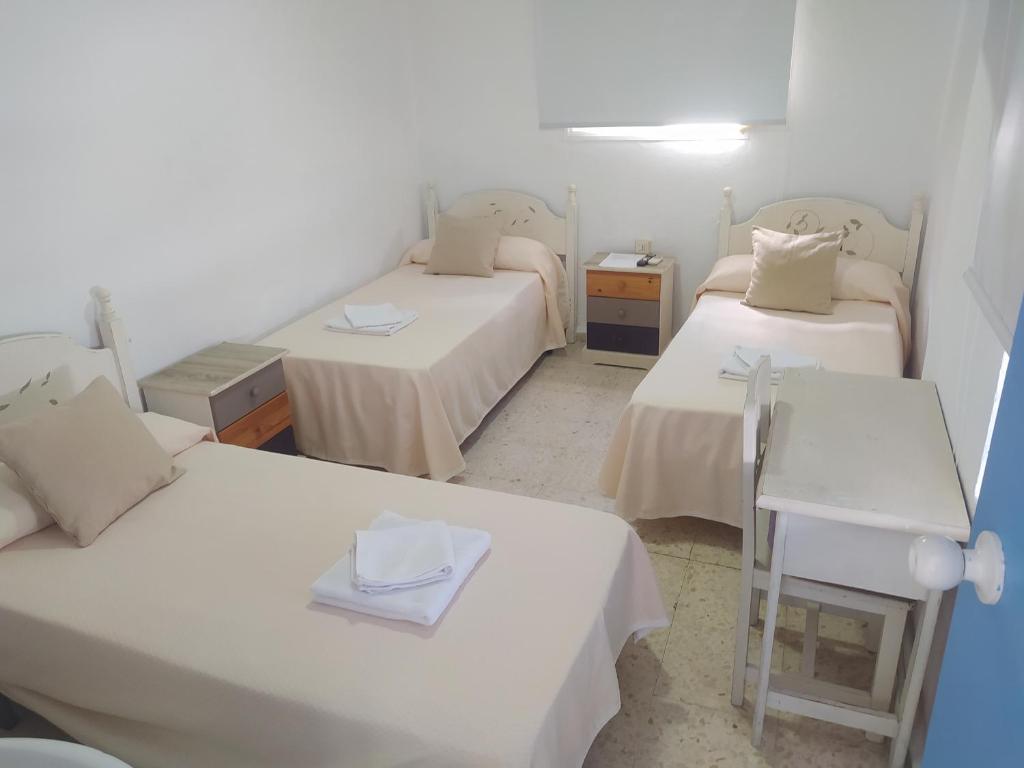Postel nebo postele na pokoji v ubytování Hospederia Islasol