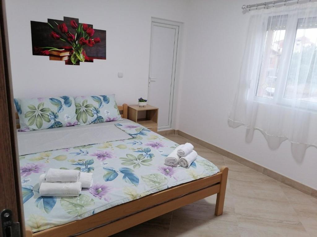 Llit o llits en una habitació de Borche Apartments