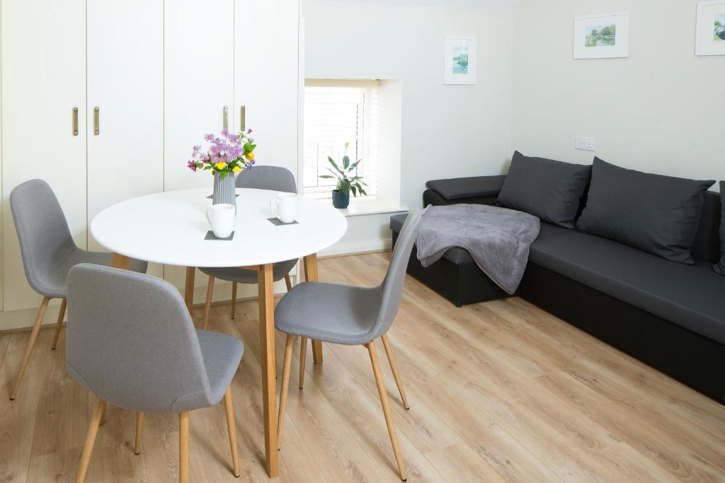 a living room with a table and a couch at Sallins Loft in Sallins