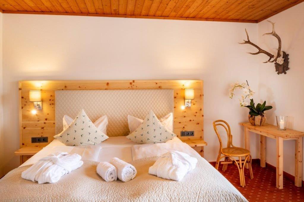 Posteľ alebo postele v izbe v ubytovaní Hotelresort Klopeinersee