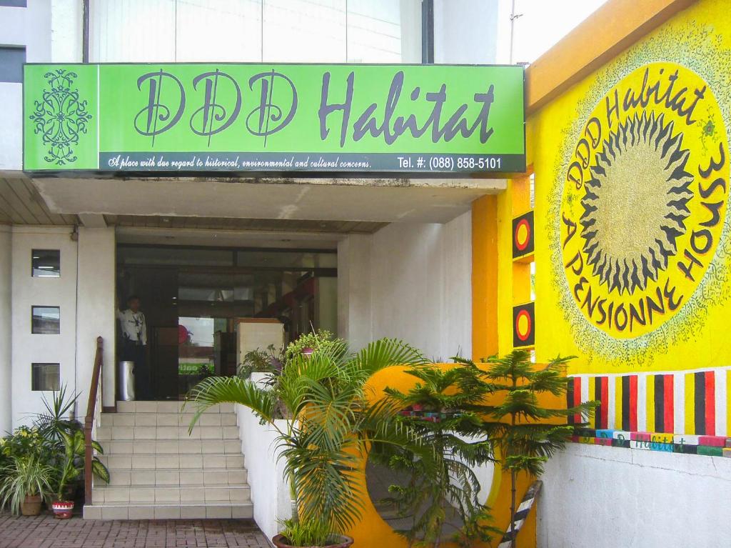 a building with a sign that reads bad habitat at OYO 679 Ddd Habitat Pension House in Cagayan de Oro