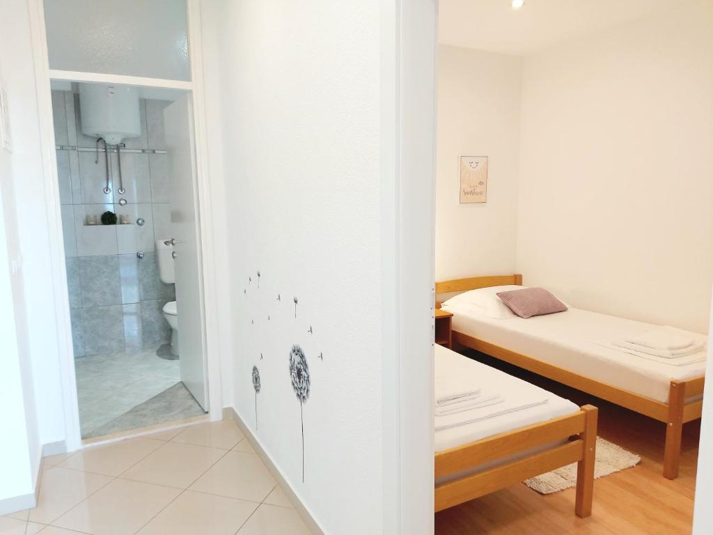 Postel nebo postele na pokoji v ubytování Apartman Anna