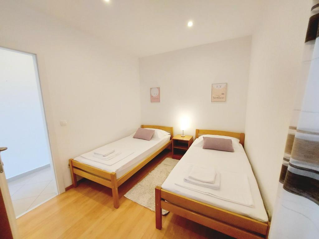 Postel nebo postele na pokoji v ubytování Apartman Anna