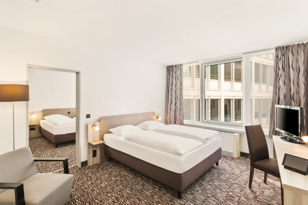 Postel nebo postele na pokoji v ubytování Best Western Plus Hotel Dresden City
