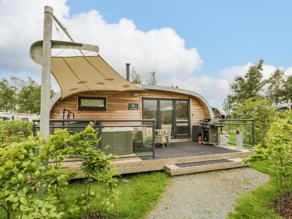 a circular house with a wrap around deck at Barbondale in Carnforth