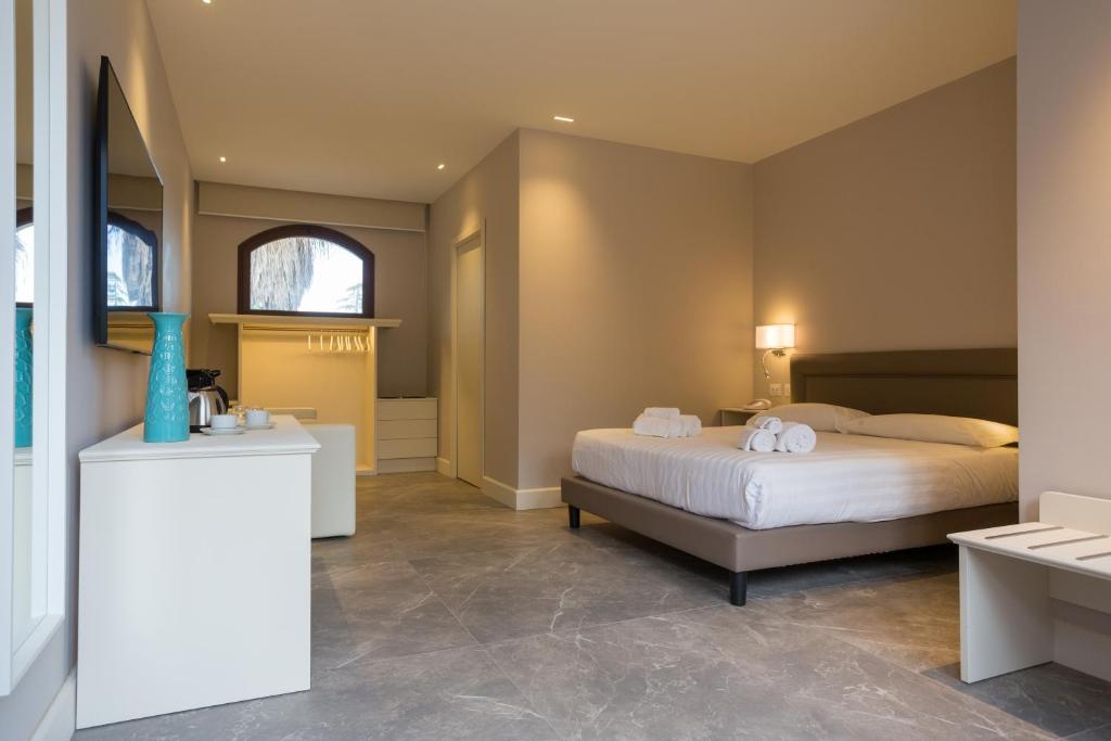 Postel nebo postele na pokoji v ubytování Airone Wellness Hotel