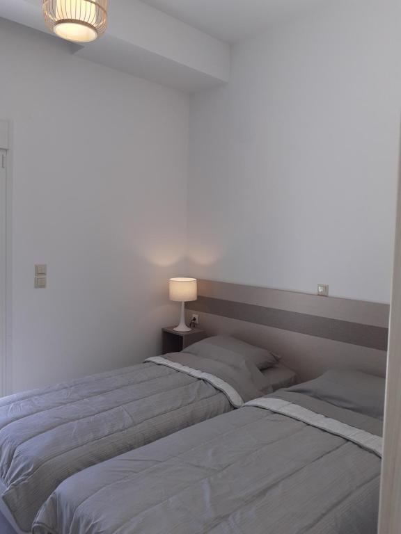 Postel nebo postele na pokoji v ubytování Villas Lago e Mare