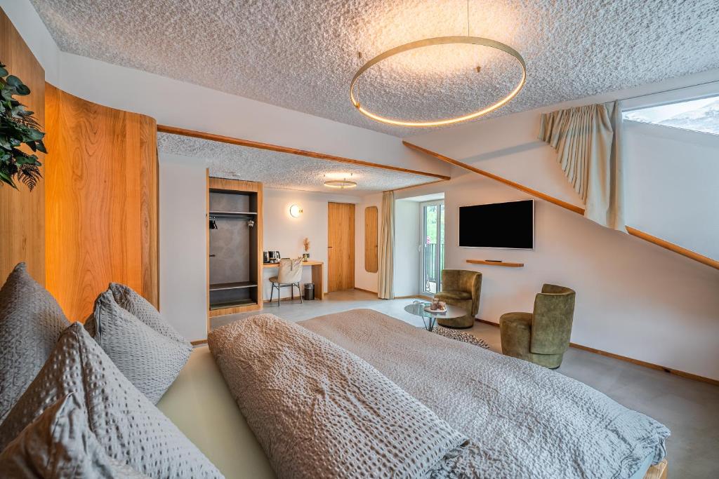 TV a/nebo společenská místnost v ubytování Boutique Hotel La Gorge