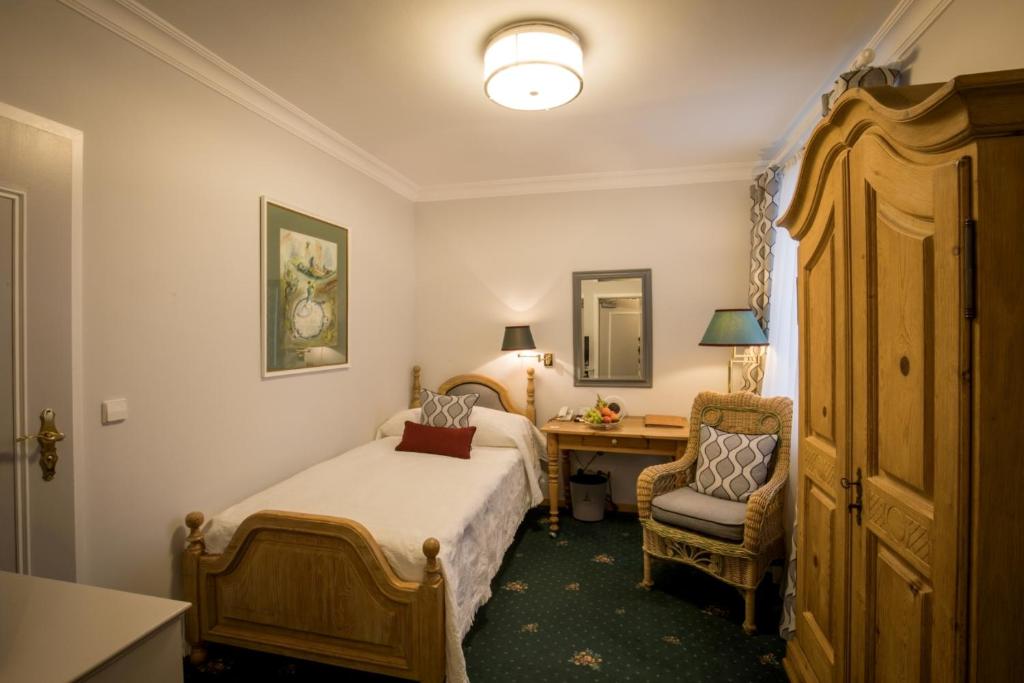 Postel nebo postele na pokoji v ubytování Hotel Der Kleine Prinz