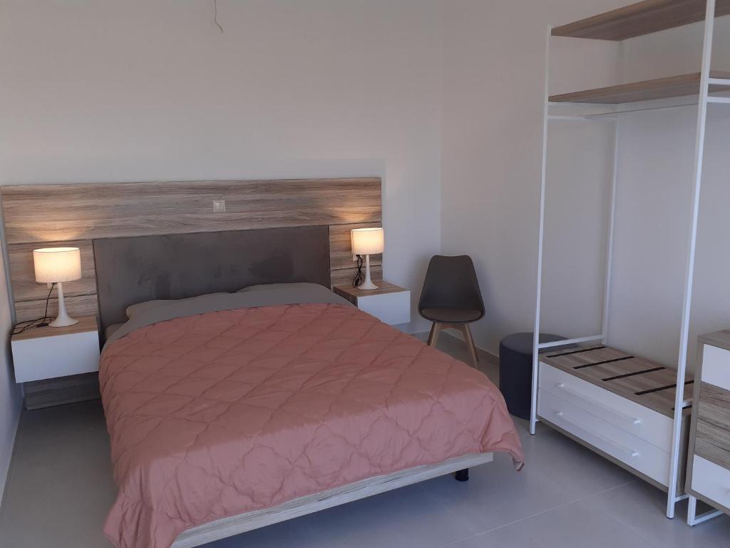 Postel nebo postele na pokoji v ubytování Villas Lago e Mare