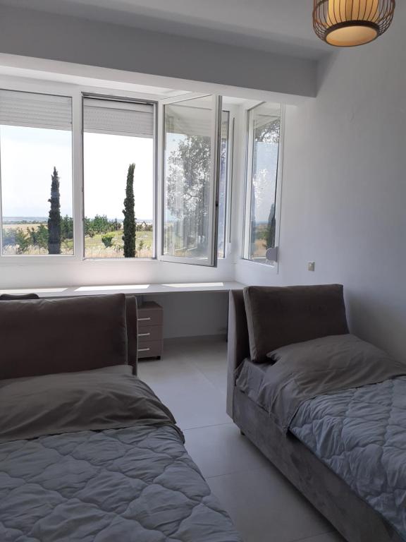 Postel nebo postele na pokoji v ubytování Villas Lago e Mare