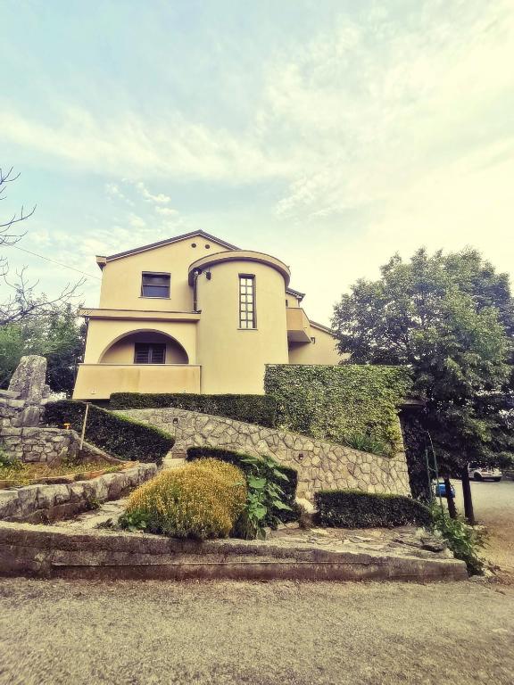 a house on top of a stone wall at Diego in Rijeka