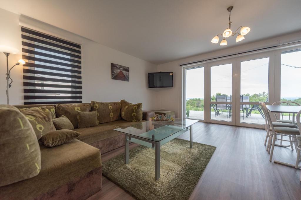 Posezení v ubytování Bridgiet Home Apartman