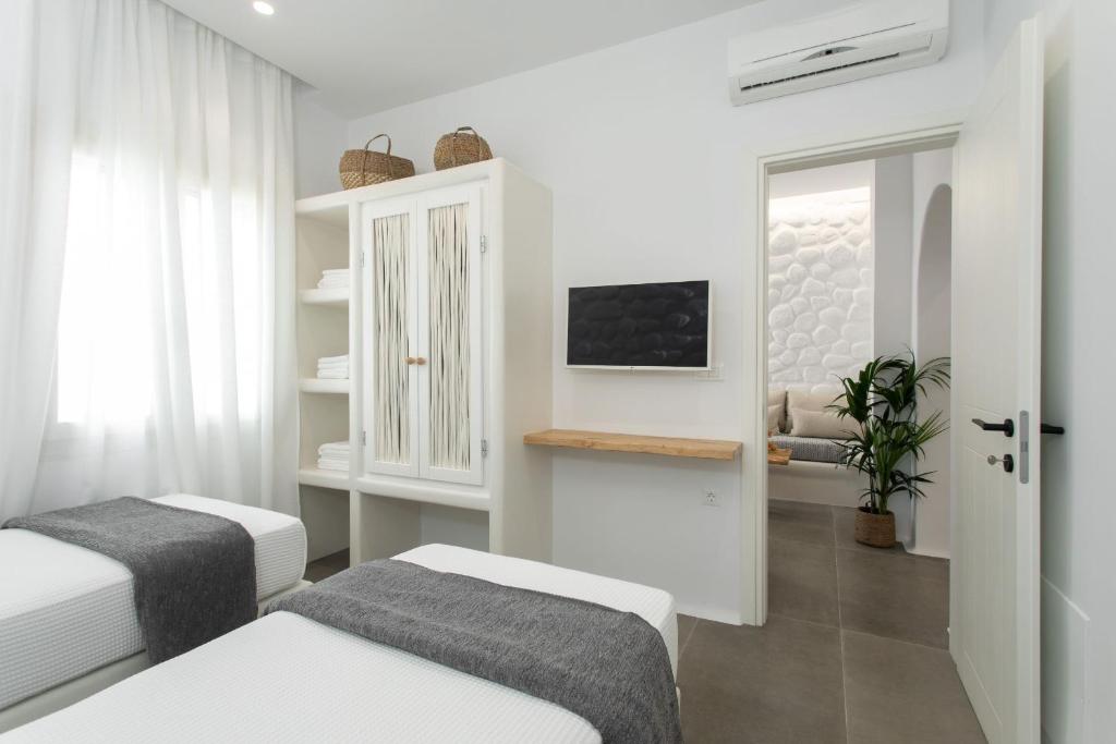 Televízia a/alebo spoločenská miestnosť v ubytovaní Kamvas Deluxe Apartments