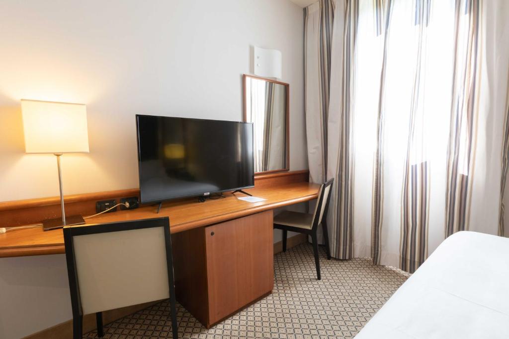 TV a/nebo společenská místnost v ubytování Belstay Milano Linate