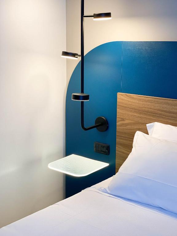 Postel nebo postele na pokoji v ubytování Belstay Milano Linate